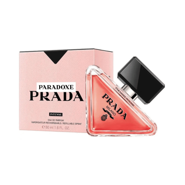 A triangular bottle of Prada Paradoxe Intense perfume next to its pink box.