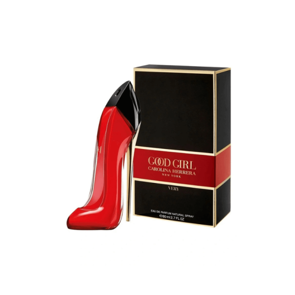 A bright red stiletto-shaped bottle of Carolina Herrera Very Good Girl perfume is shown next to its black and red box.